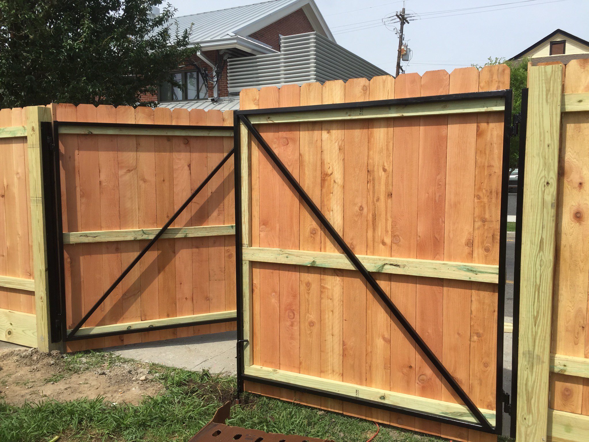 Wooden privacy fence installation